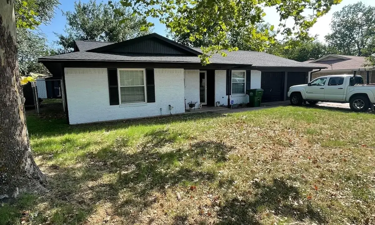 Professional roofing crew working on a residential roof in Hammond